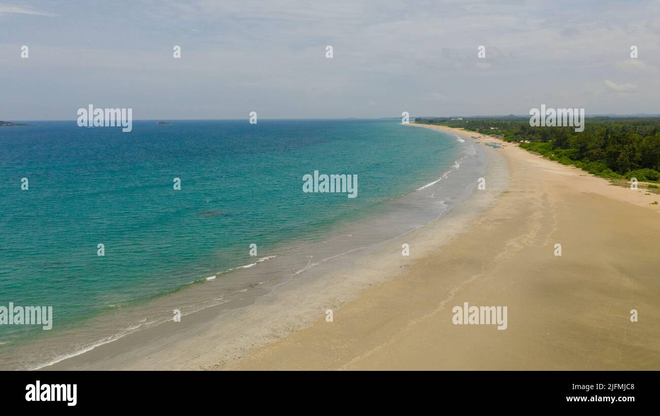 A tropical beach with palm trees and a blue ocean. Sri Lanka Stock ...