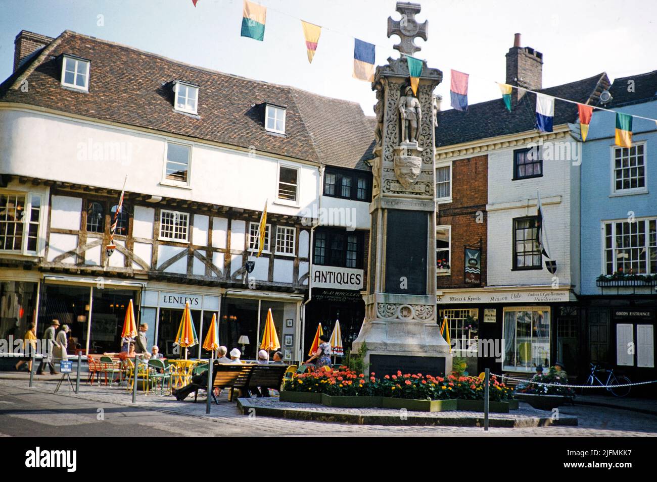 War Memorial and shops in historic buildings, Buttermarket, Canterbury, Kent, England, UK early 1960s Stock Photo