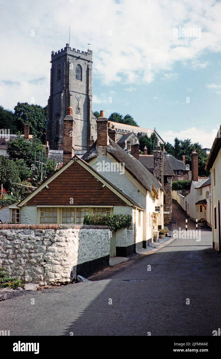 Historic thatched cottages and church of Saint Michael, Pilgrim Corner with former pub, Vicarage Road, Minehead, Somerset, England, UK early 1960s Stock Photo