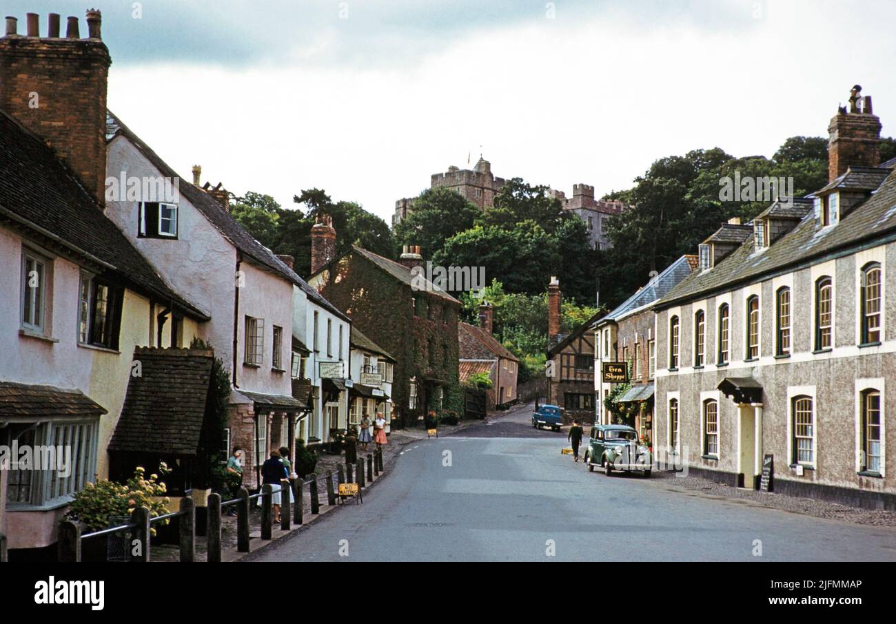Dunster castle and historic buildings, main village street, High Street, Dunster, Somerset, England, UK early 1960s Stock Photo