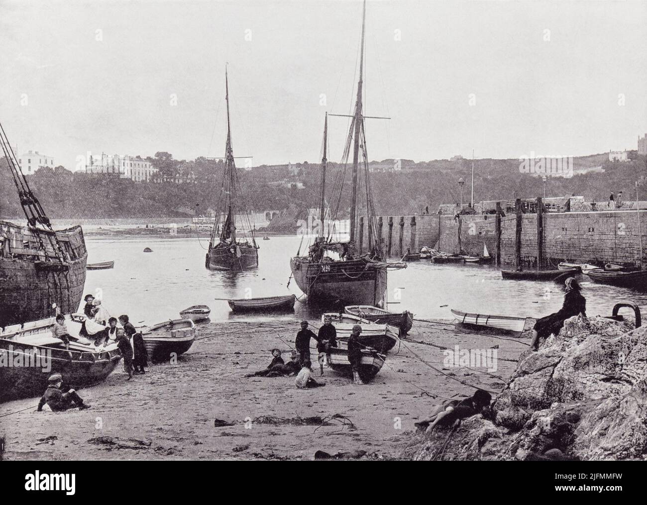 Tenby, Pembrokeshire, Wales.  The harbour seen here in the 19th century.  From Around The Coast,  An Album of Pictures from Photographs of the Chief Seaside Places of Interest in Great Britain and Ireland published London, 1895, by George Newnes Limited. Stock Photo