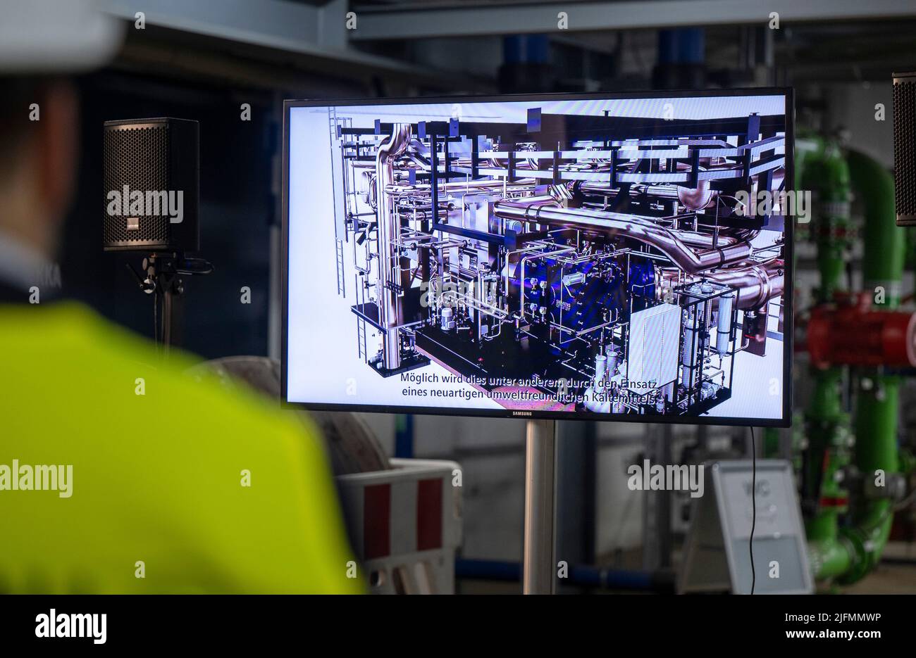 Berlin, Germany. 04th July, 2022. A journalist watches a film about how