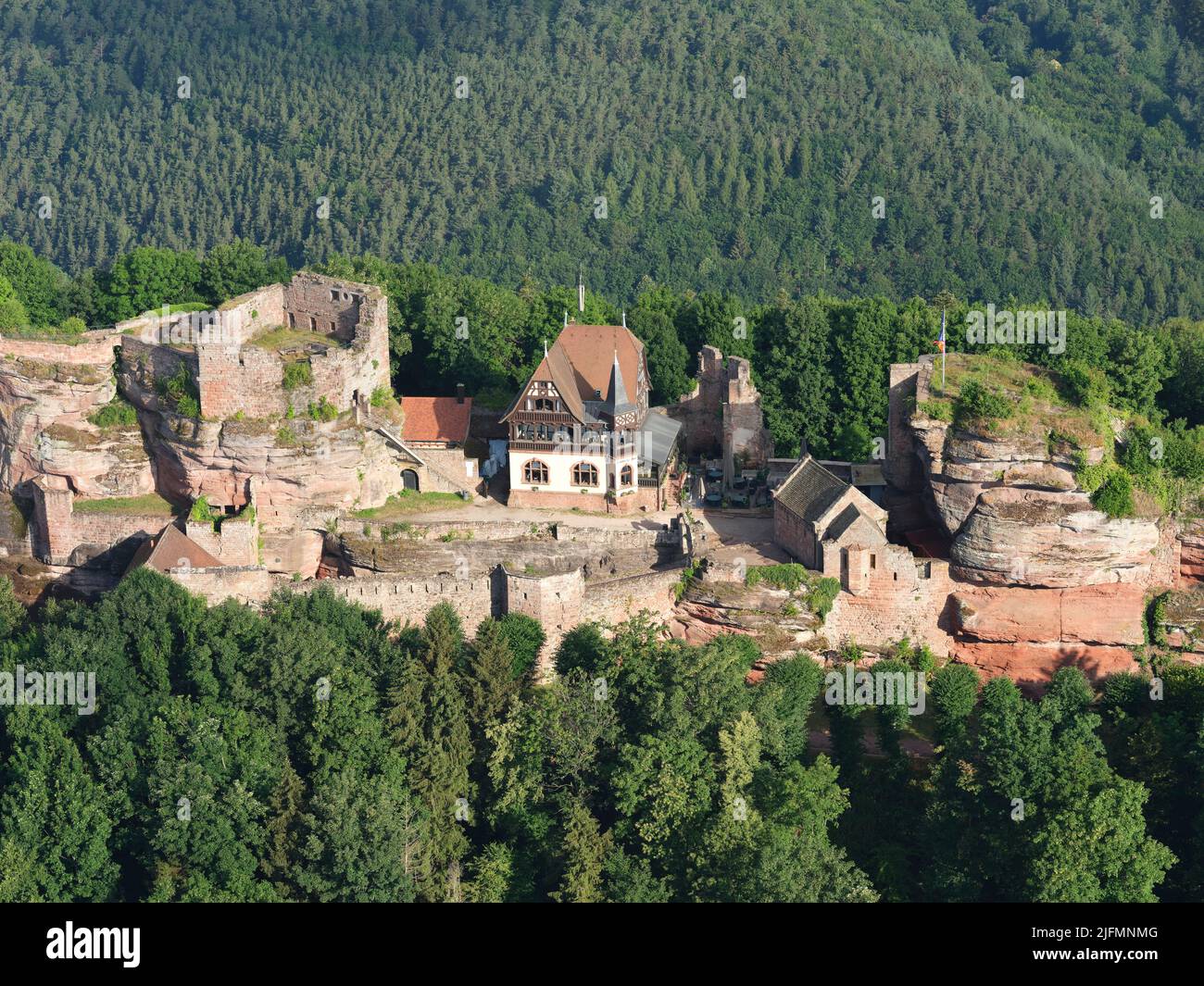AERIAL VIEW. Ruins of a medieval castle built on an outcrop of sandstone on the Eastern Vosges mountains. Haut-Barr Castle, Saverne, Alsace, France. Stock Photo