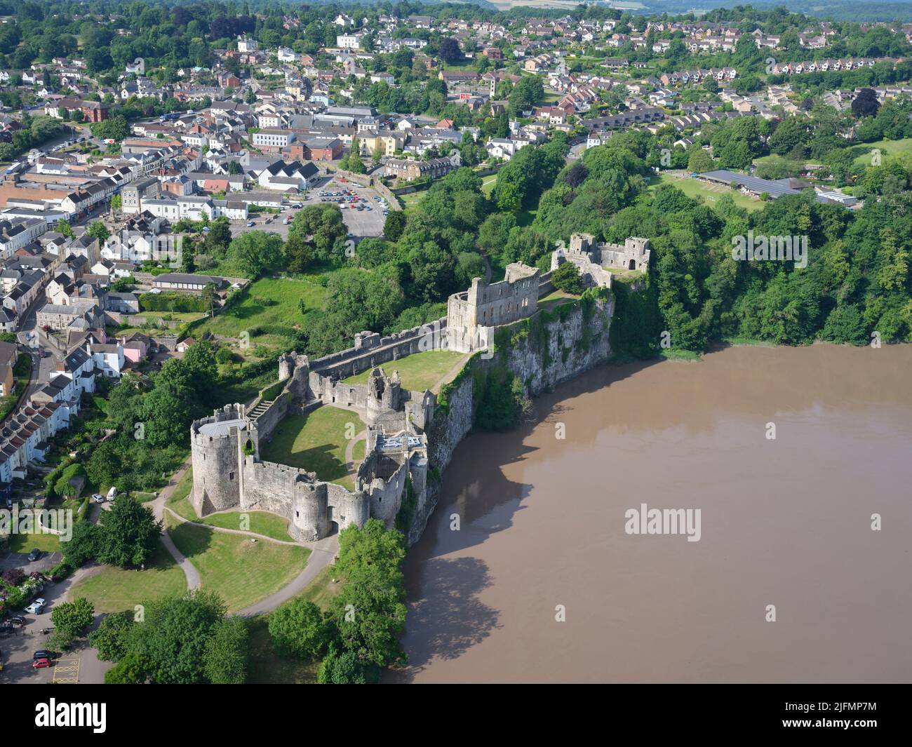AERIAL VIEW. Chepstow Castle on a clifftop on the right bank of the Wye River. Monmouthshire, Wales, United Kingdom. Stock Photo