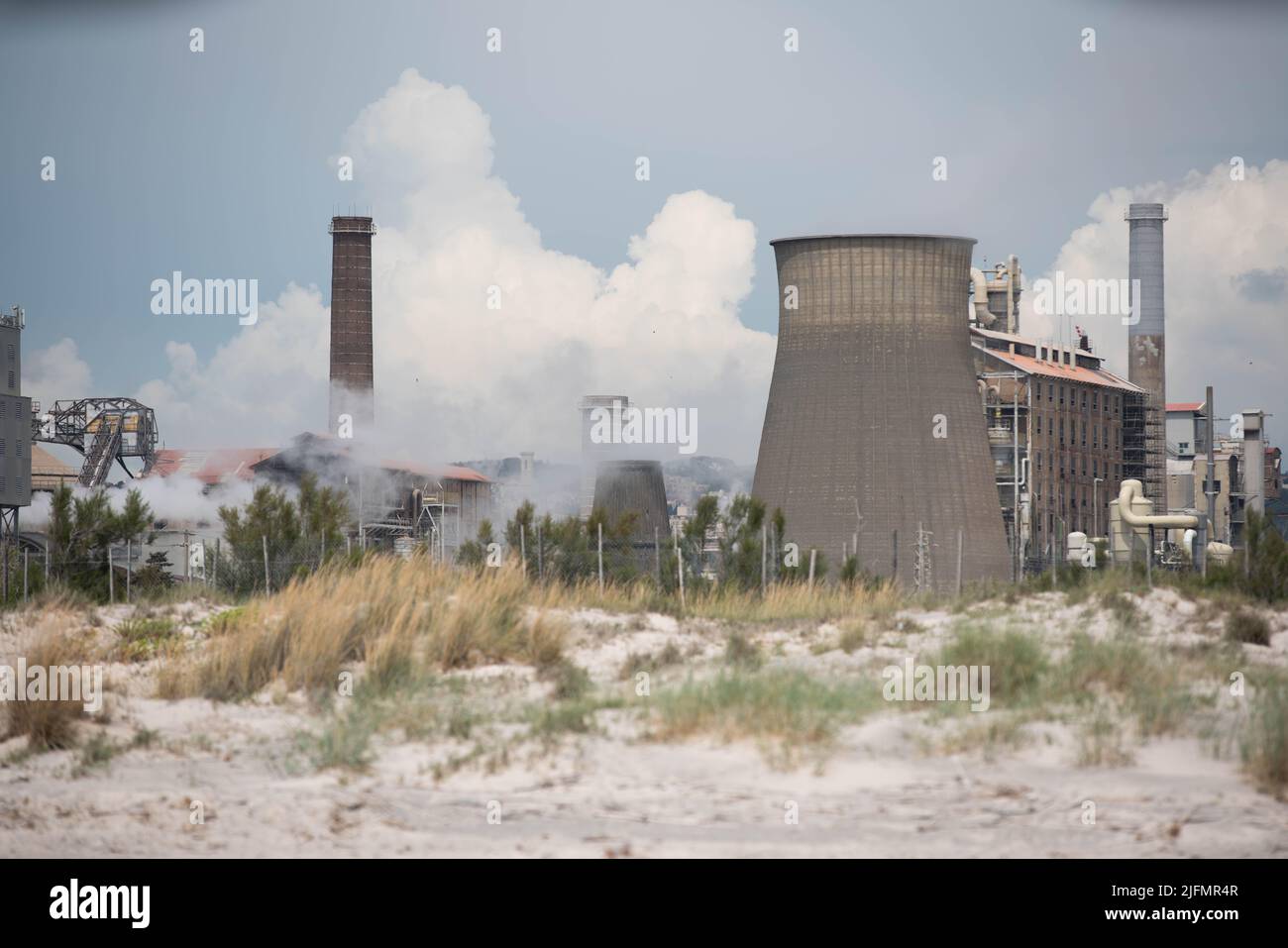 Rosignano, Italy June 8. 2021 Chemical plant in Italy. Cooling Tower