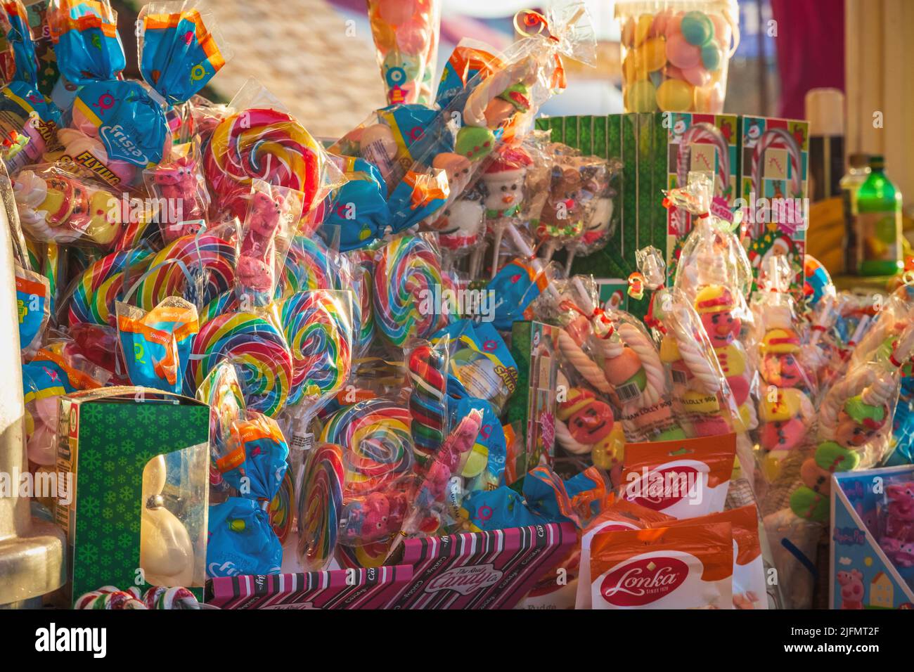 London, UK - 2 December, 2021 - Sweets on display at a confectionery stall of Christmas market Hyde Park Winter Wonderland Stock Photo