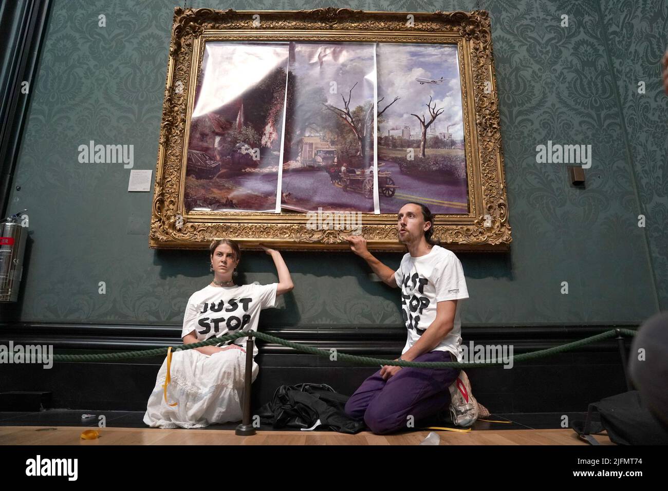 Protesters from Just Stop Oil climate protest group, glue their hands