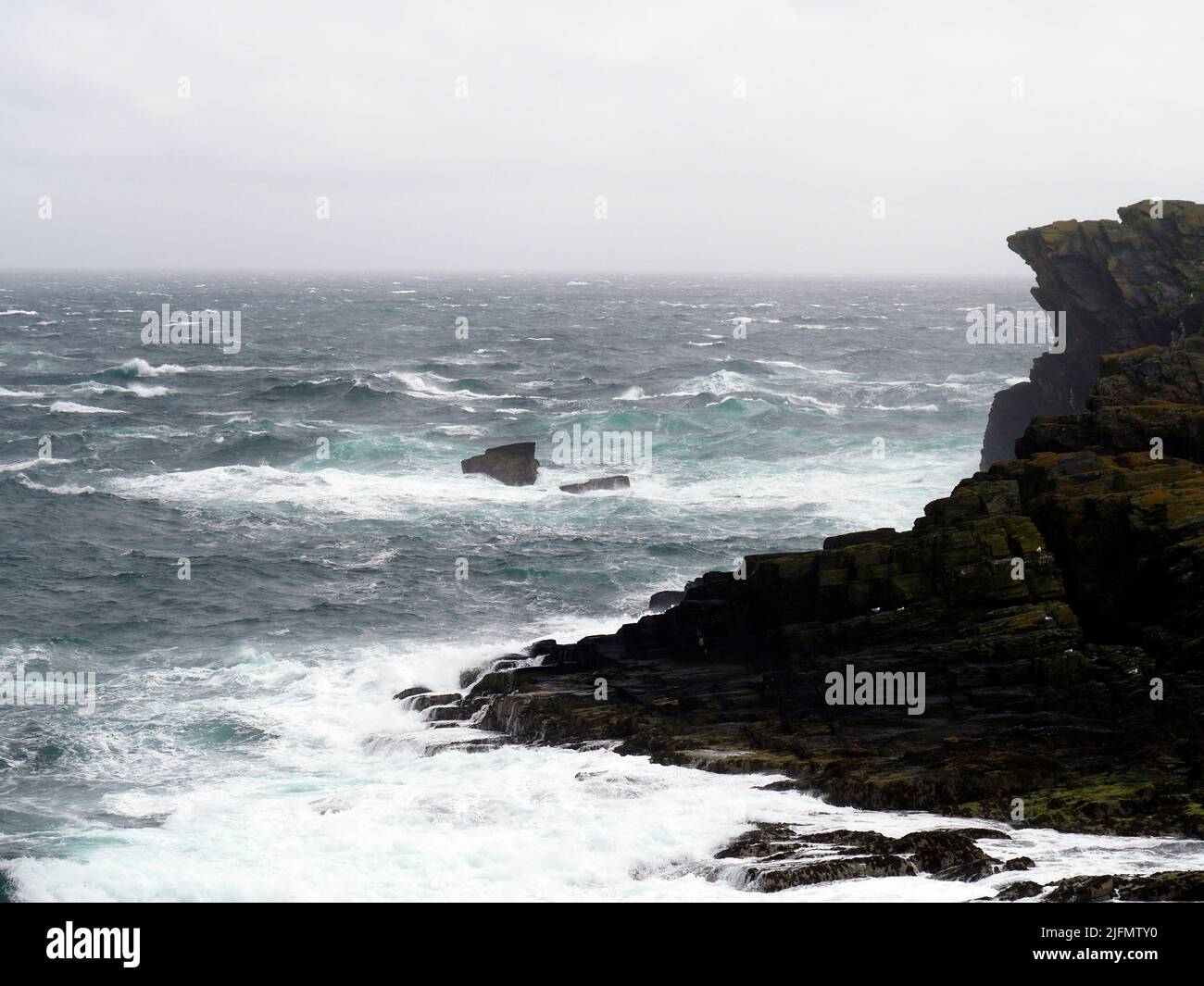 Waves breaking on Burroo, calf of Man, Isle of Man Stock Photo