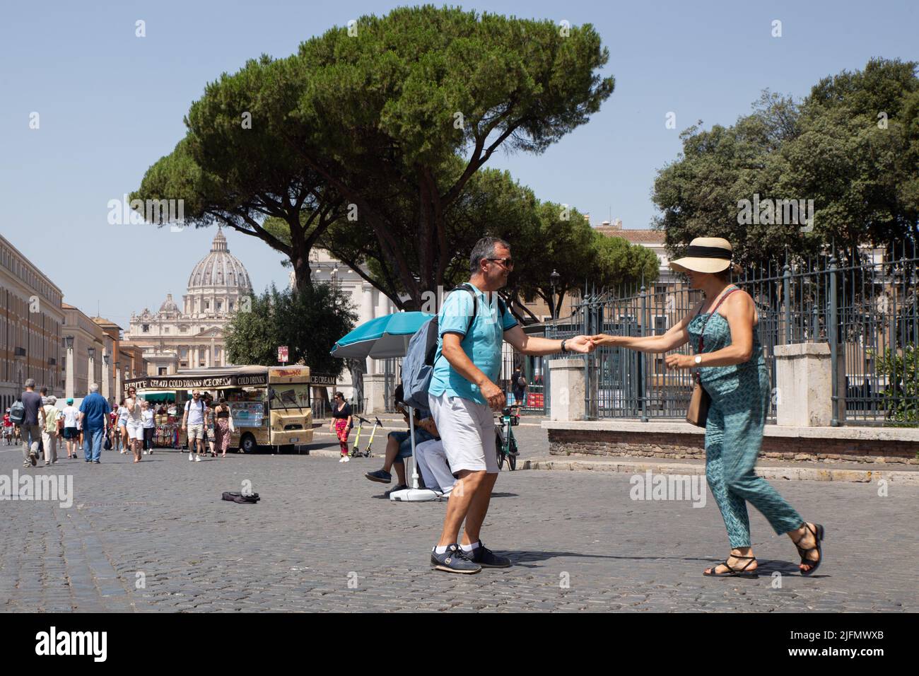 Rome, Italy. 4th July, 2022. Tourists dance to the music of street musicians near Castel Sant'Angelo on a hot summer day (Credit Image: © Matteo Nardone/Pacific Press via ZUMA Press Wire) Stock Photo