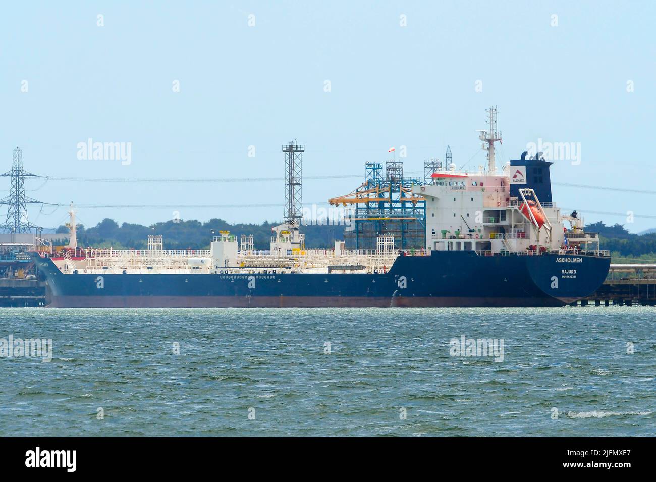 Fawley, Hampshire, UK.  4th July 2022.  General view of the tanker Askholmen which is docked at the Fawley Oil Refinery which sits on the banks of Southampton Water near Southampton in Hampshire and is owned by the ESSO Petroleum Company.  Picture Credit: Graham Hunt/Alamy Live News Stock Photo