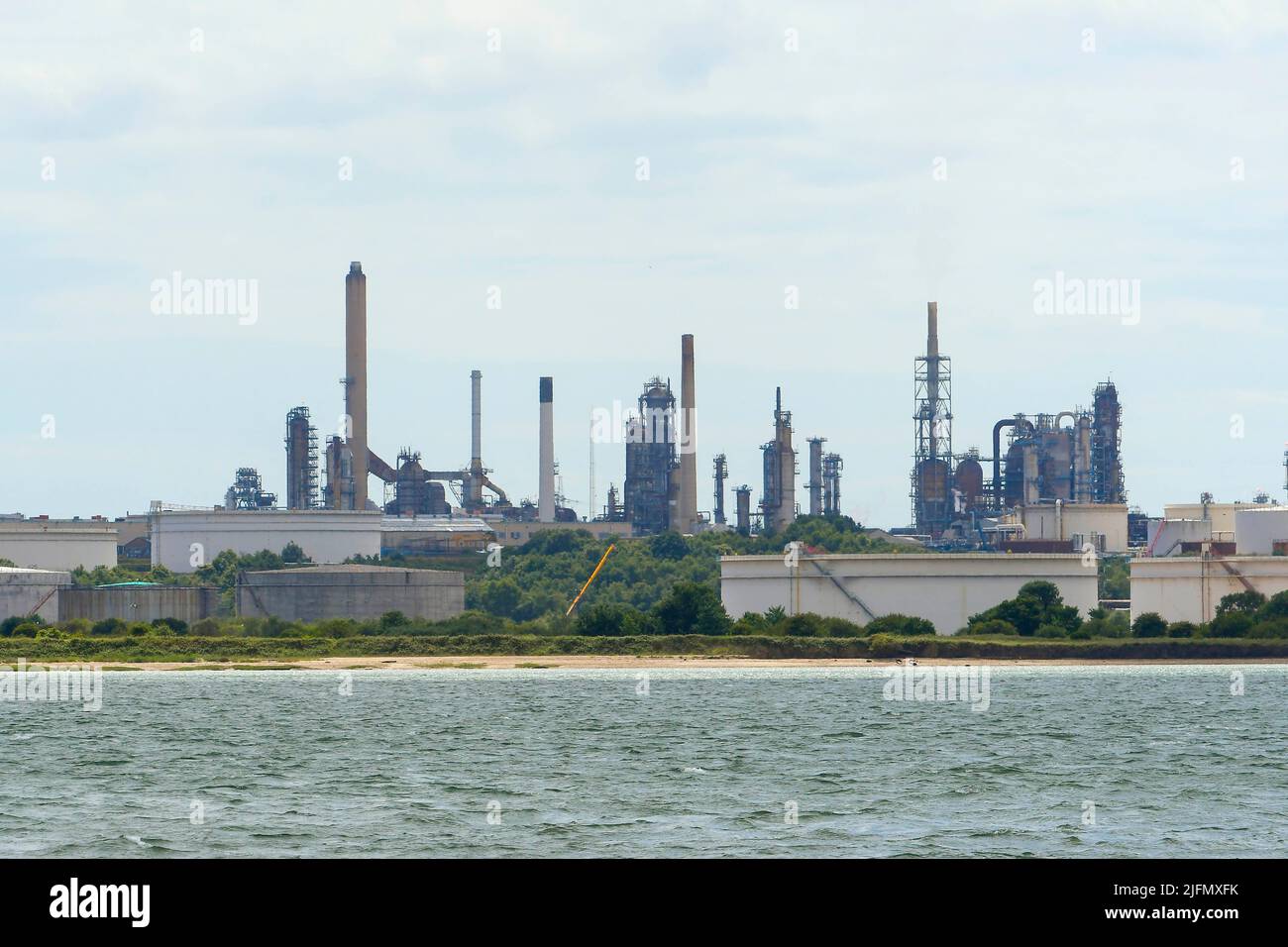 Fawley, Hampshire, UK.  4th July 2022.  General view of the Fawley Oil Refinery which sits on the banks of Southampton Water near Southampton in Hampshire which is owned by the ESSO Petroleum Company.  Picture Credit: Graham Hunt/Alamy Live News Stock Photo