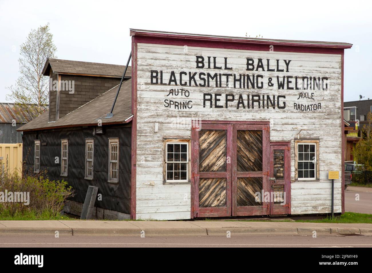 Exterior of the historic 1911 Bill Bally Blacksmithing & Welding Repairing shop in Grand Marais, Minnesota Stock Photo