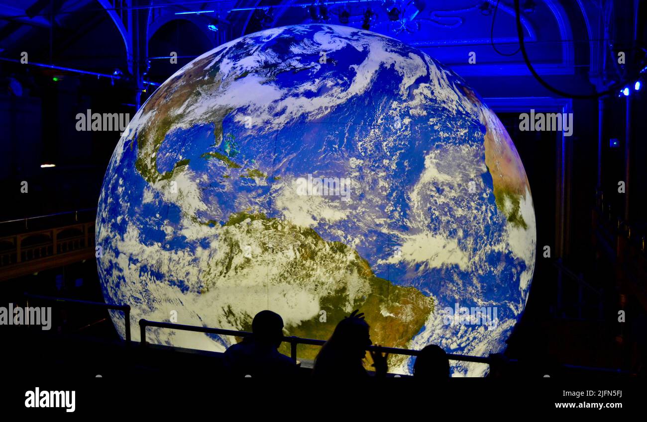 Hartlepool, UK. 04 Jul 2022. A stunning, illuminated replica of planet Earth named ‘Gaia’ by Luke Jerram is displayed at the Town Hall Theatre, Hartlepool, UK. Members of the public have been invited to come and see the enormous 7 metre diameter, world class art attraction which has been brought to the area by Hartlepool Council as part of their cultural activities. Children and adults alike have been left in awe. Credit: Teesside Snapper/Alamy Live News Stock Photo