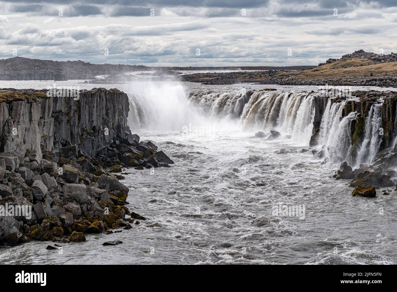 The waterfall Selfoss seen from the east bank of river Jokulsa a Fjollum, in northern Iceland Stock Photo