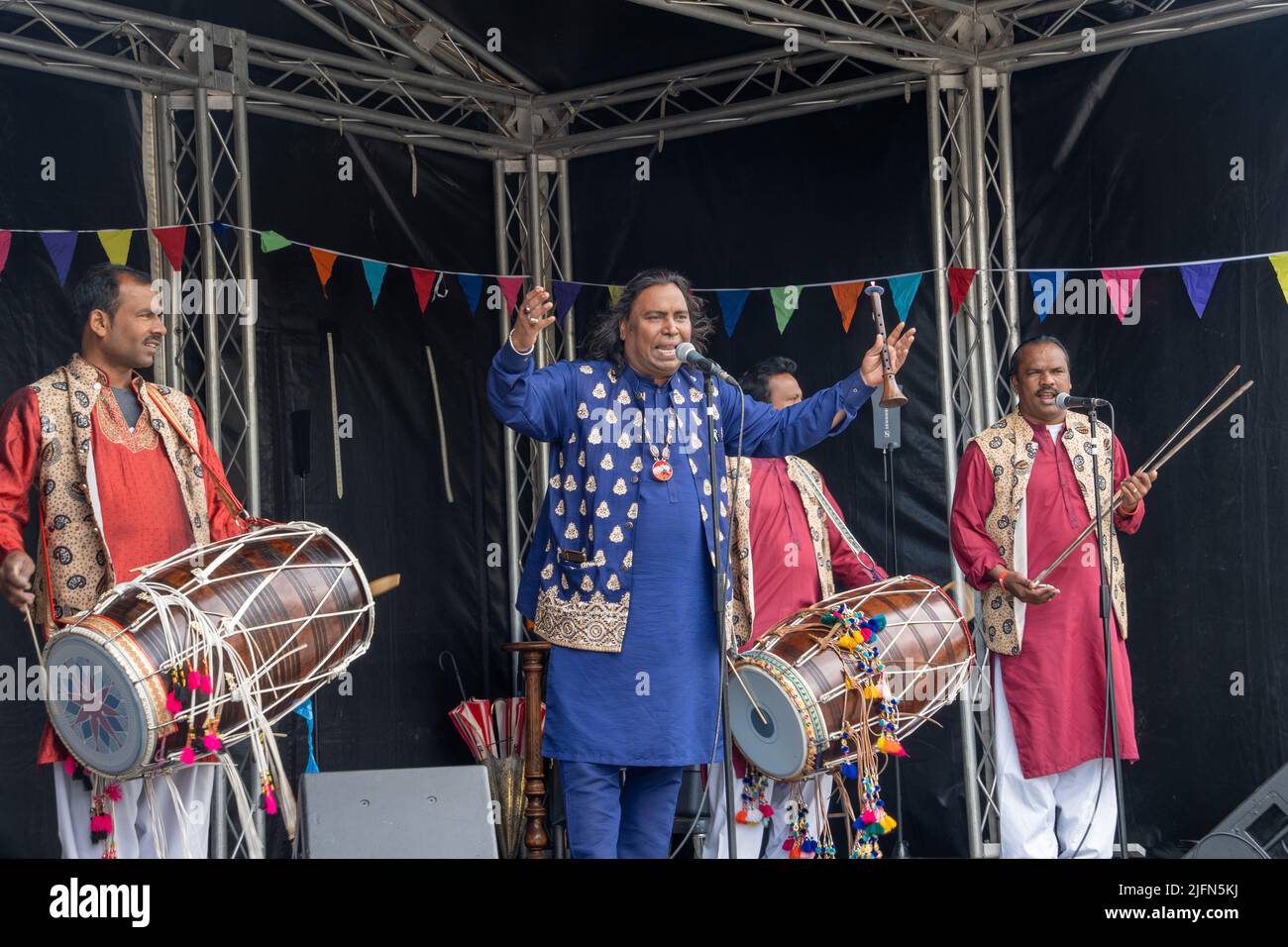 Traditional Pakistani punjabi dhol players and tooti, on an outdoor stage in Bradford, UK. Stock Photo
