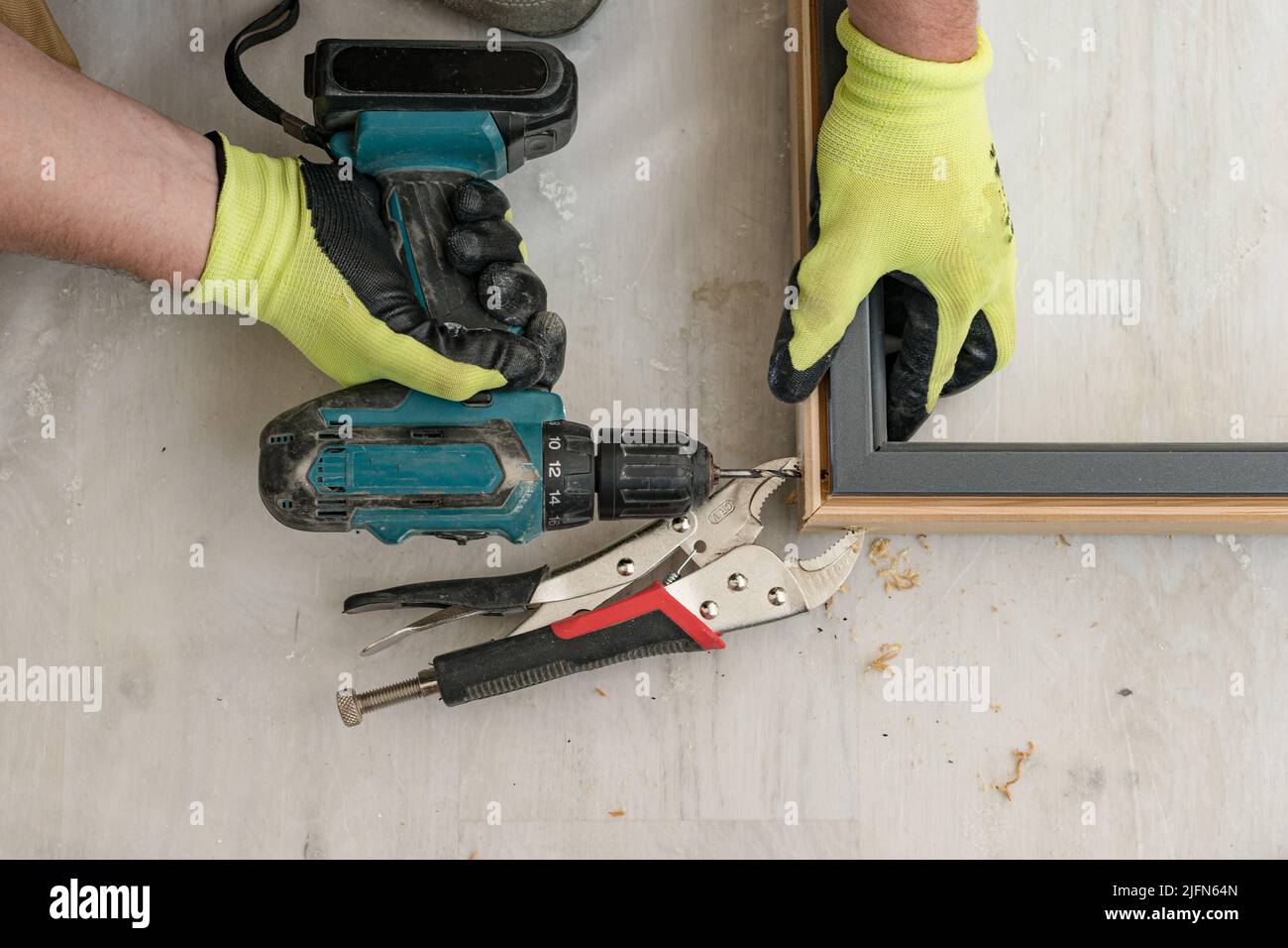 Drilling a hole in the door frame for a corner connection, installation of interior doors Stock