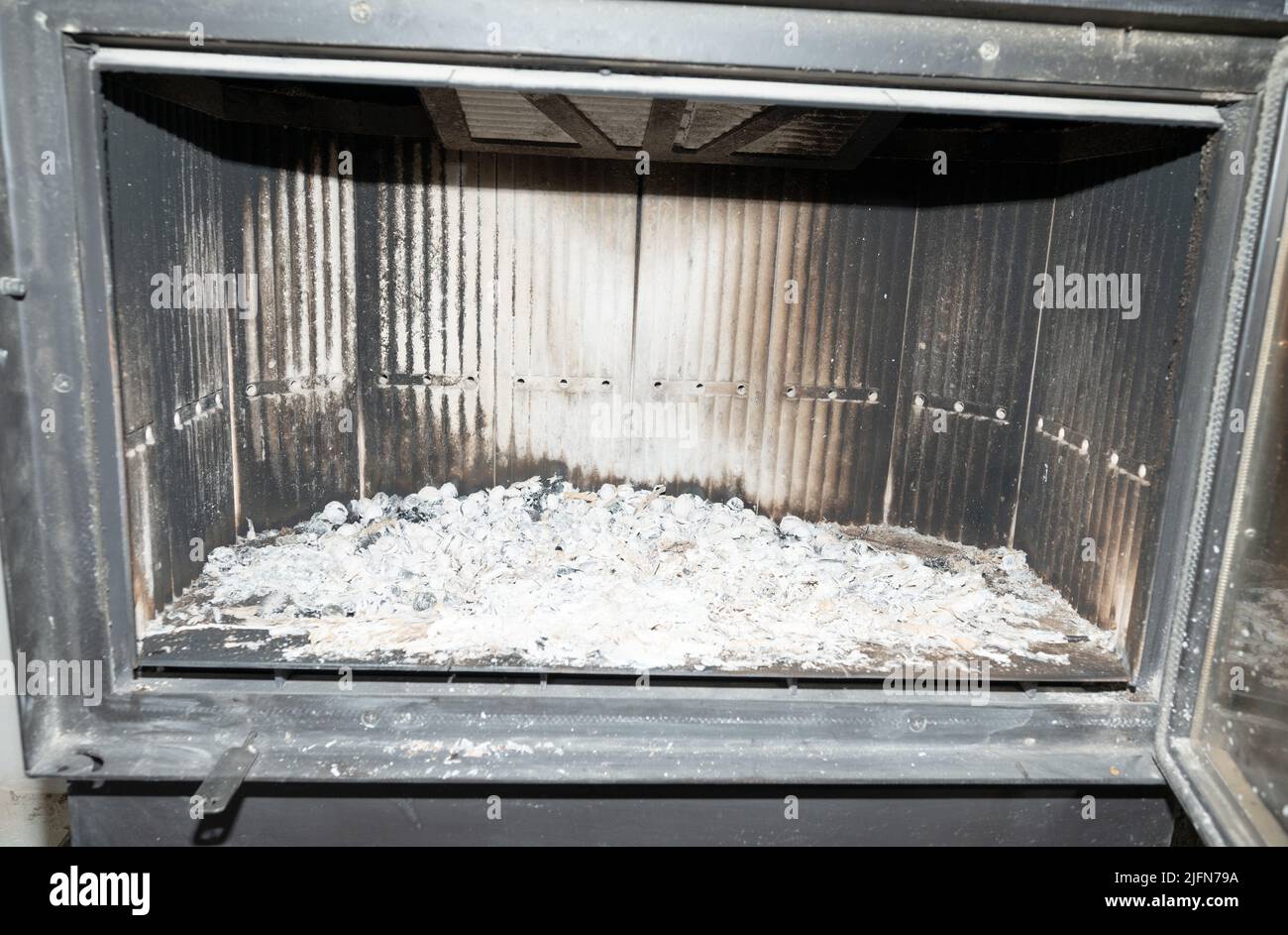 Fireplace and ashes close up, fireplace in the middle with fireclay