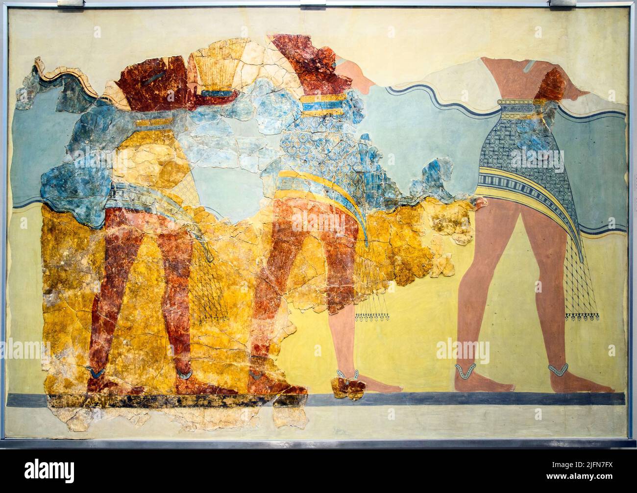 Part of the 'Procession Fresco' showing three men walking to the right. one of them carries a large vessel, probably made of alabaster. they are dress Stock Photo