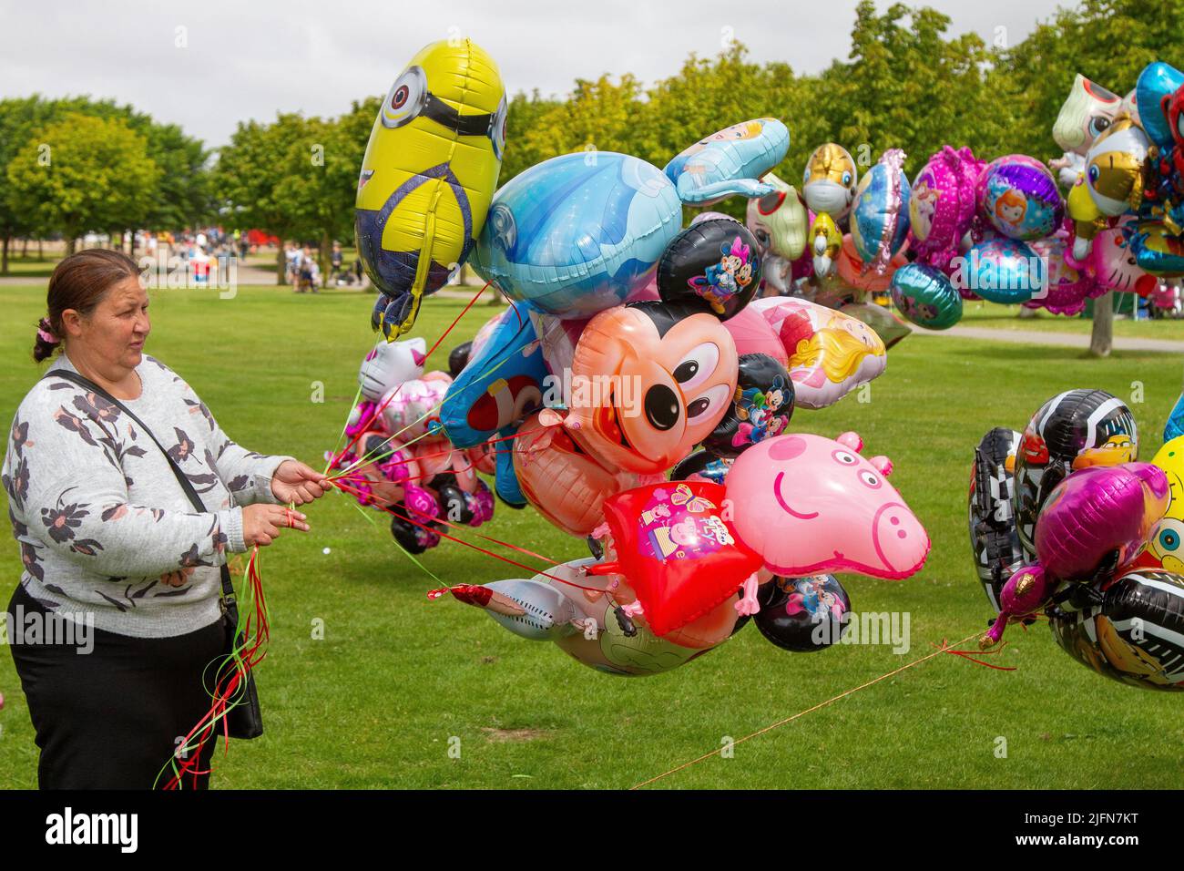 Helium Inflated Balloon Seller, at the Far Away Land event in Southport