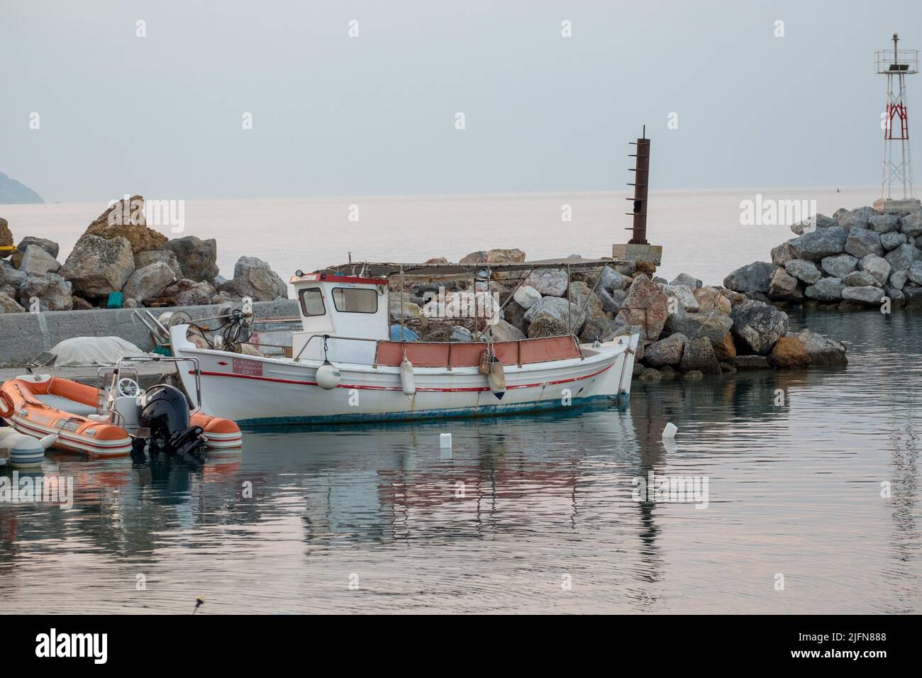 Seascape scenery of fishing boats in a harbor Stock Photo