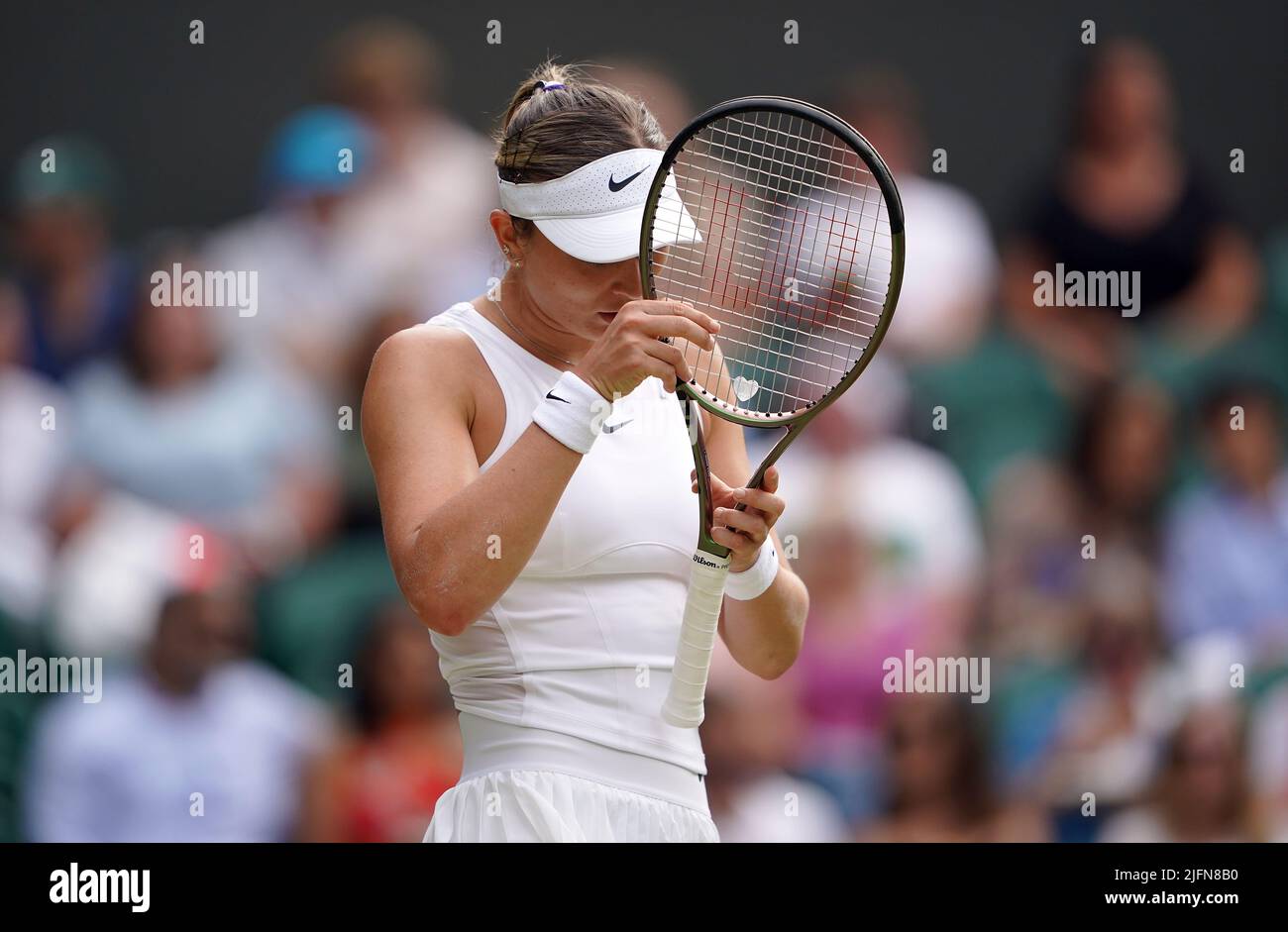 Paula Badosa reacts during their Ladies' Singles fourth round match against Simona Halep on day eight of the 2022 Wimbledon Championships at the All England Lawn Tennis and Croquet Club, Wimbledon. Picture date: Monday July 4, 2022. Stock Photo