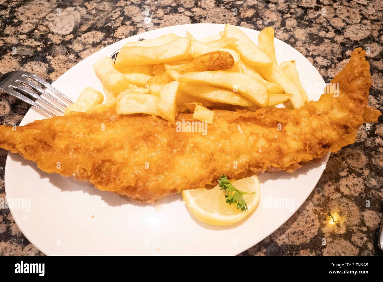 Excellent haddock fish and chips at the famous Trenchers Cafe in Whitby Stock Photo