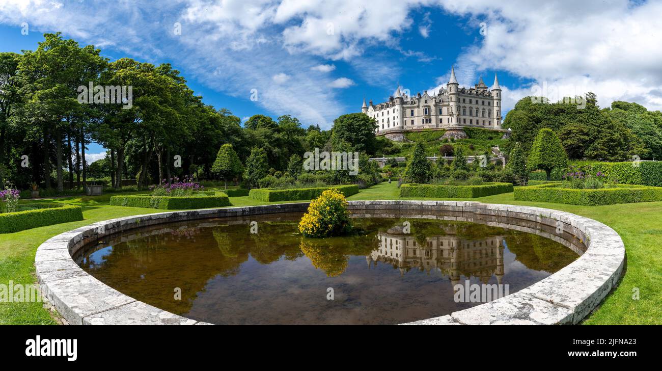 Golspie, United Kingdom - 25 June, 2022: view of Dunrobin Castle and Gardens in the Scottish Highlands and castle reflection in the fountain Stock Photo