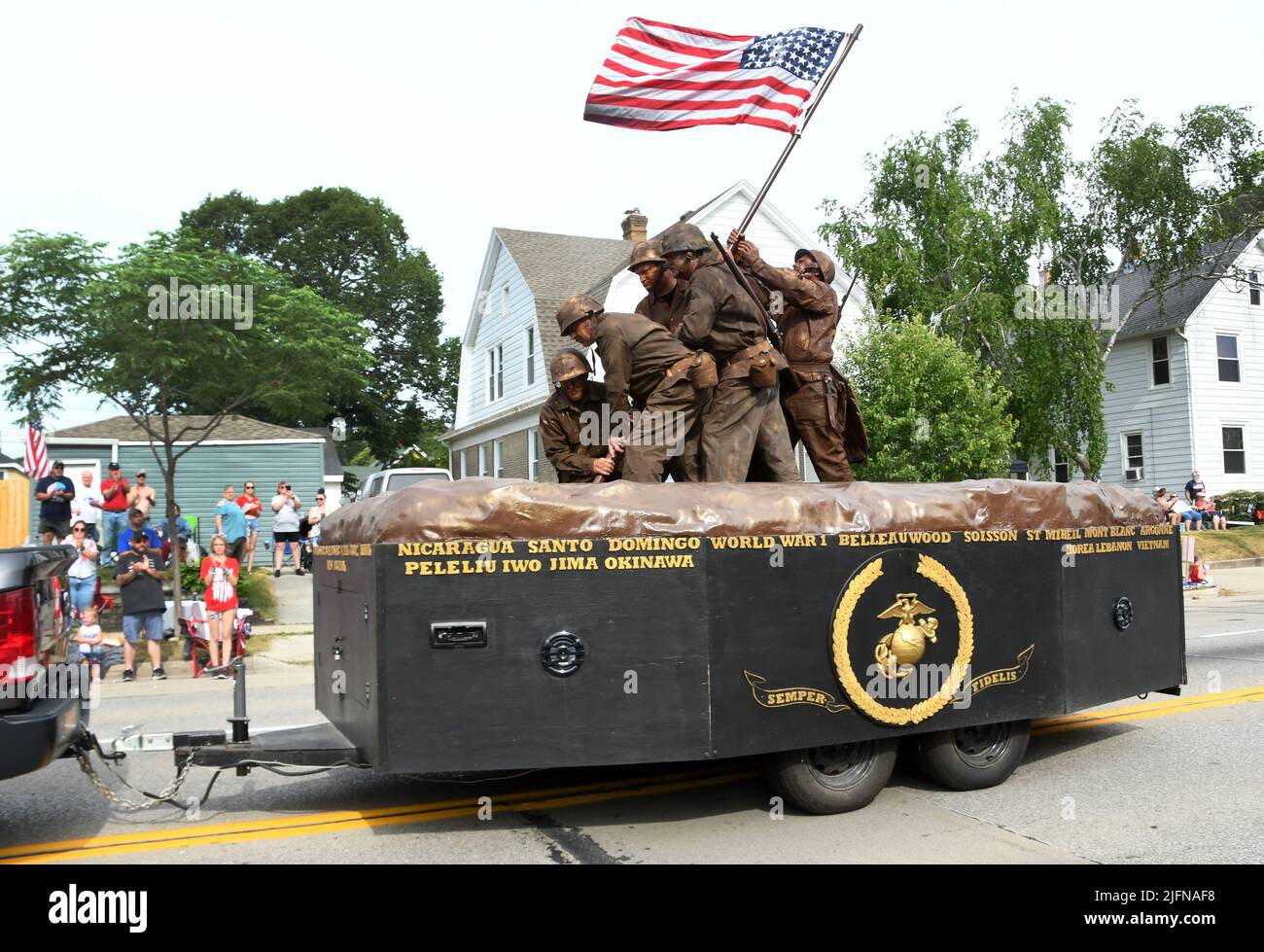 Racine, Wisconsin, USA. 4th July, 2022. One of the most popular floats in the Racine, Wisconsin 4th Fest parade is the reenactment of the flag raising on Iwo Jima. The living memorial float is from the Agerholm-Gross Detachment #346 of the Marine Corps League of Racine, It is shown during the annual 4th Fest parade, Monday July 4, 2022. (Credit Image: © Mark Hertzberg/ZUMA Press Wire) Stock Photo