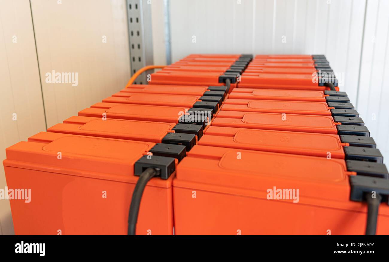 Batteries on shelves connected to a large UPS battery Stock Photo Alamy