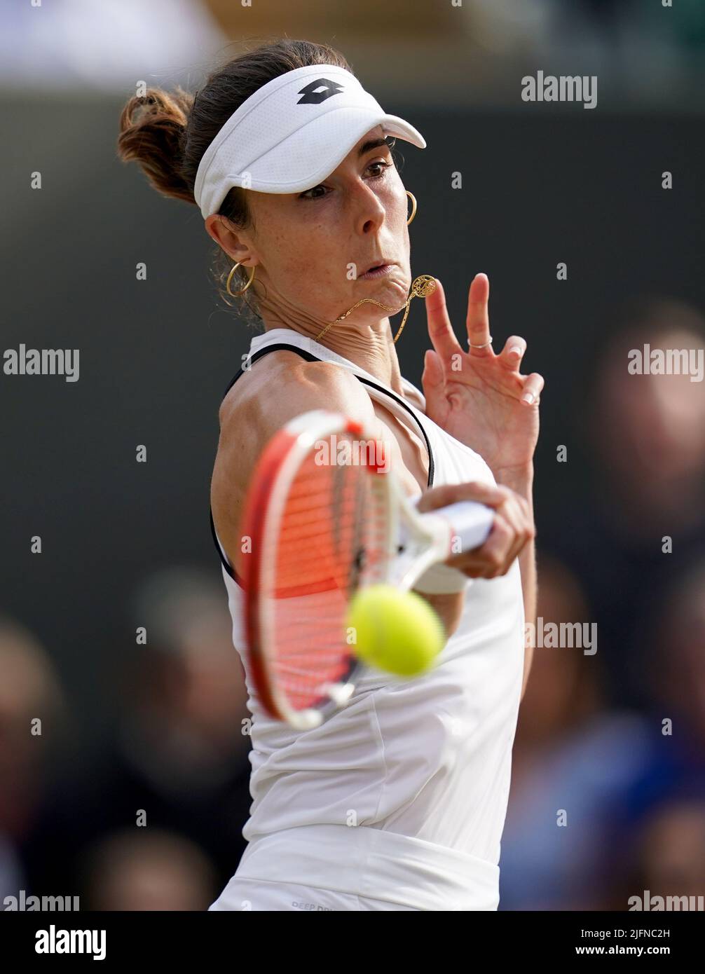 Alize in action against Ajla Tomljanovic on day eight of the 2022 Wimbledon Championships