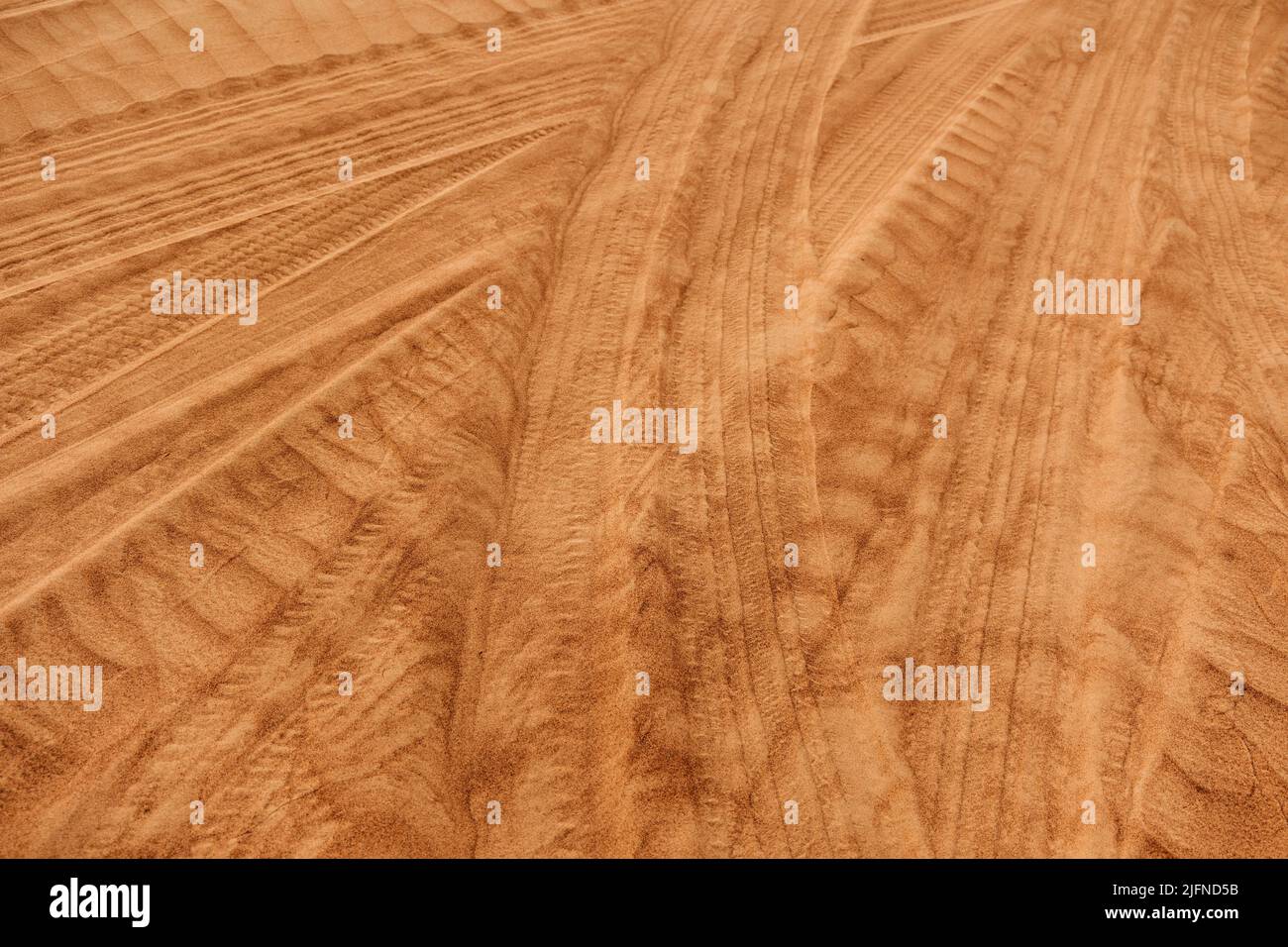 Tracks from the wheels of cars on sand dunes, racing, extreme driving. Stock Photo