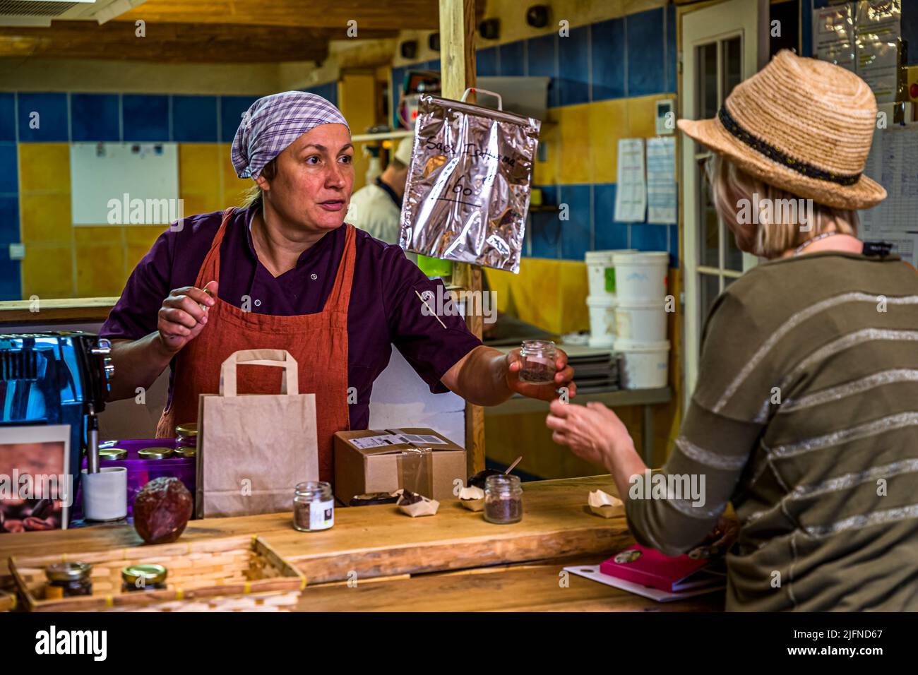 Chocolaterie Frigoulettte in Beaufort-sur-Gervanne (Die, France). Many products can be tasted at the counter with a view into the manufactory. Frigoulette cooking chocolates with the aroma of lavender, thyme or mint are used in French recipes Stock Photo