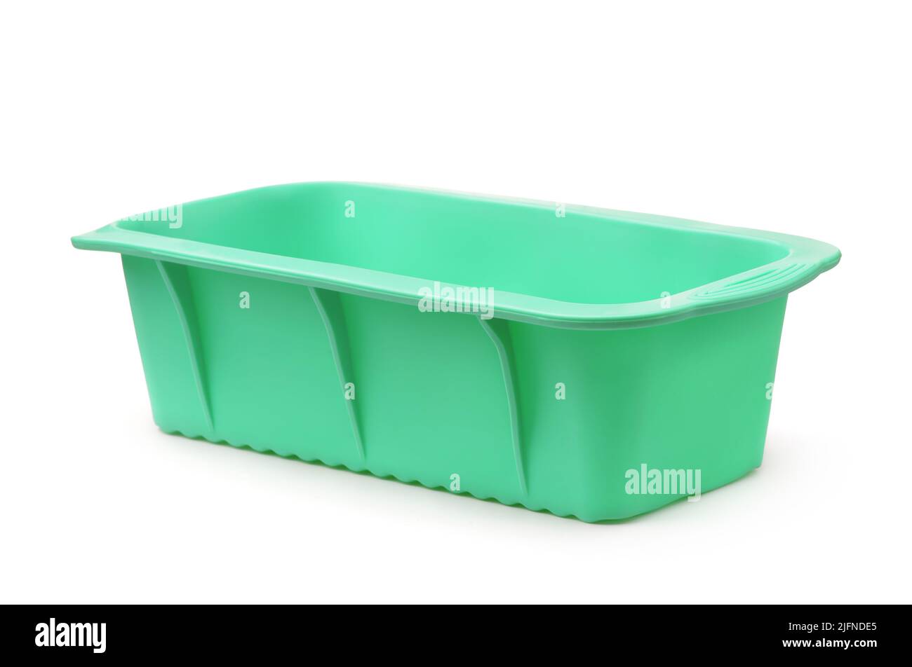 Green empty silicone baking mould isolated on white Stock Photo