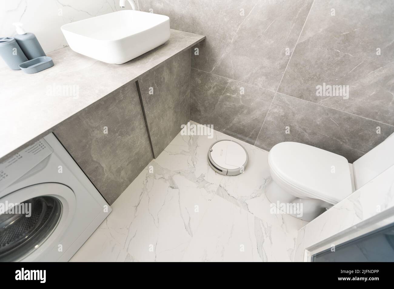 robot vacuum cleaner in the bathroom Stock Photo - Alamy