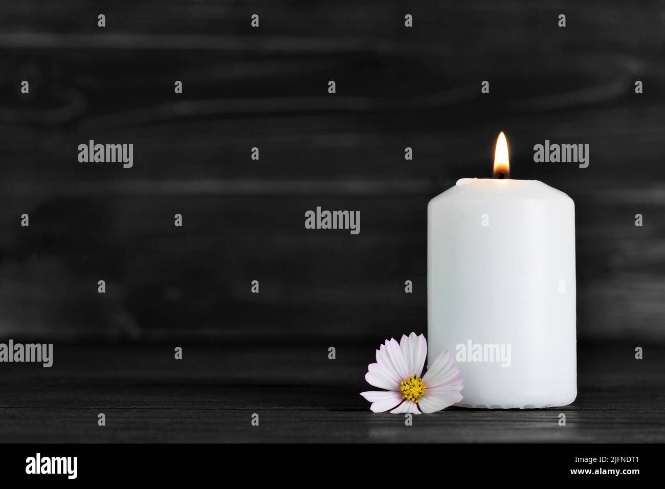 Condolence card with white candle and flower Stock Photo