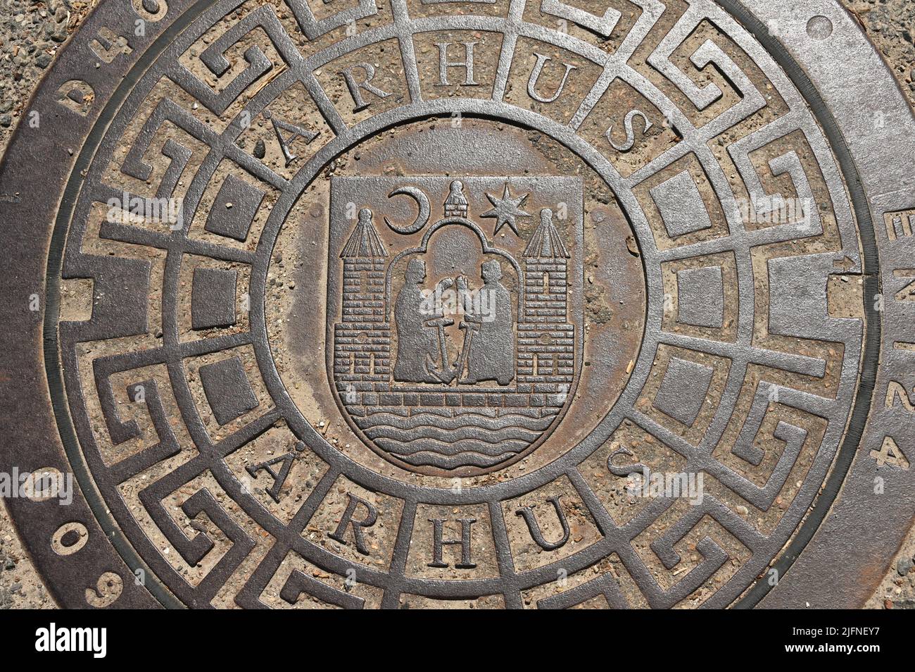 Manhole cover in the city of Aarhus in Denmark Stock Photo