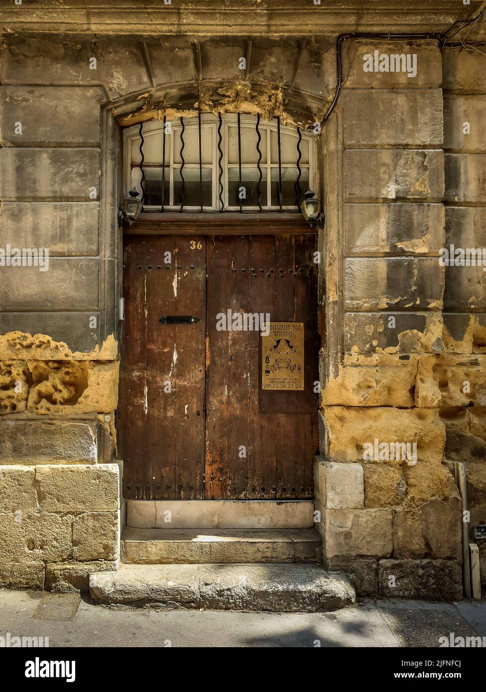 Aix-en-Provence, France, May 2022, view of a wooden close door of a tattoo shop Stock Photo
