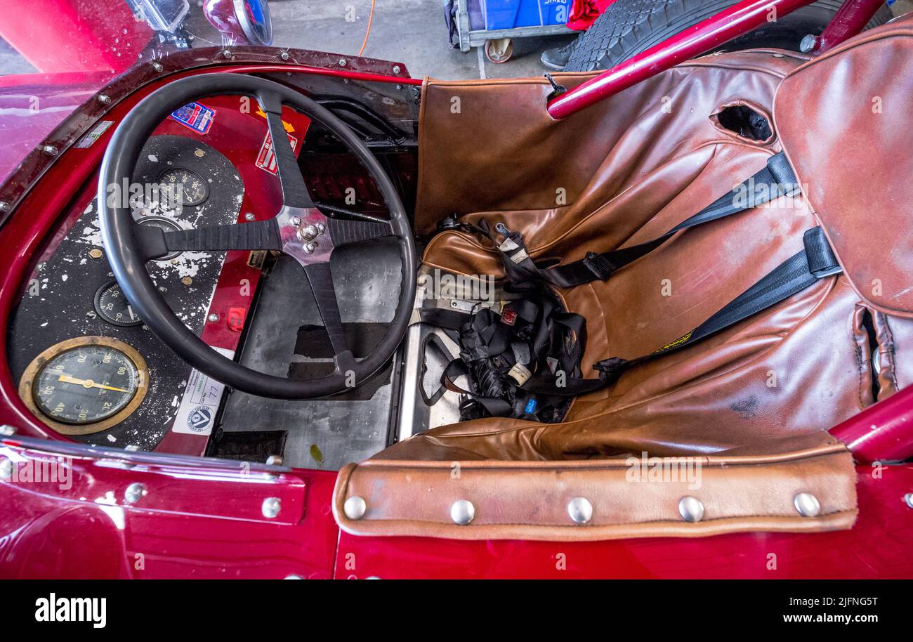 Vintage car drivers seating position, steering wheel, and seat Stock