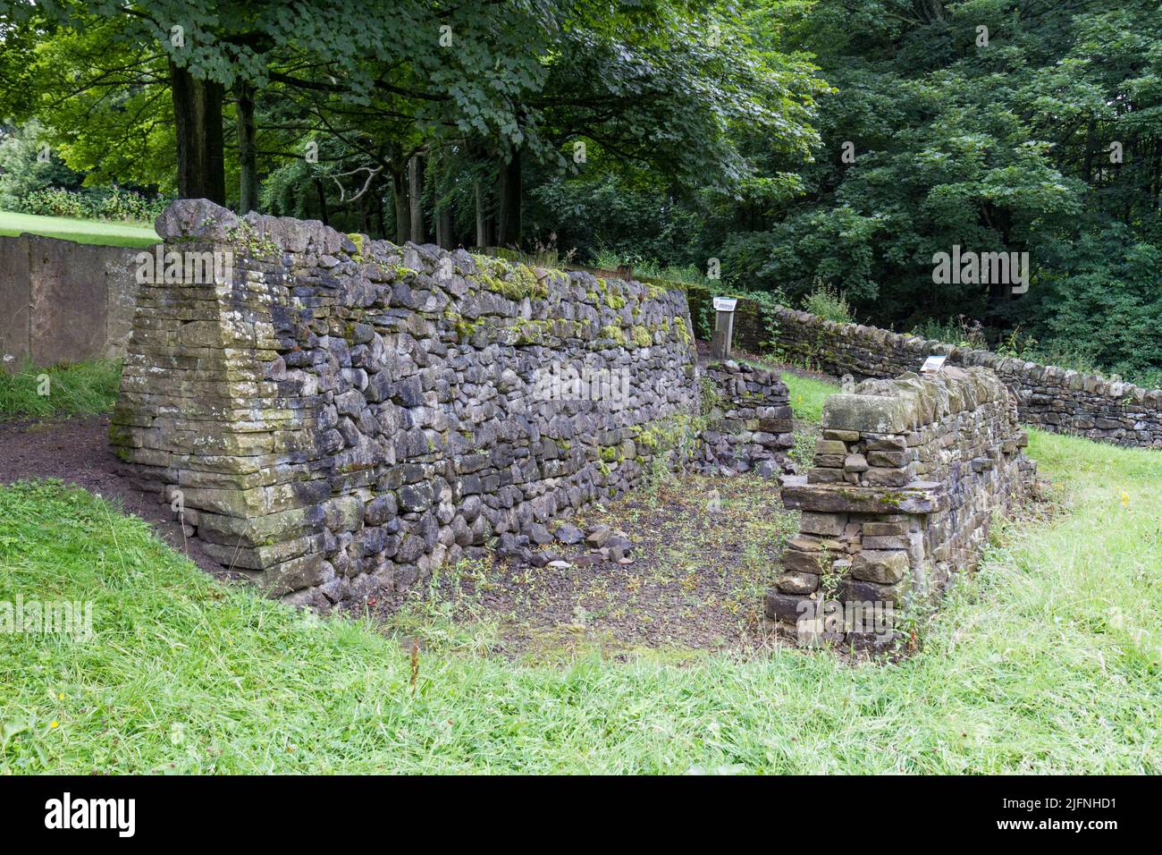 Example of retaining and training dry walls, part of a dry stone walling exhibit, Shibden Park, Halifax, Yorkshire, UK. Stock Photo