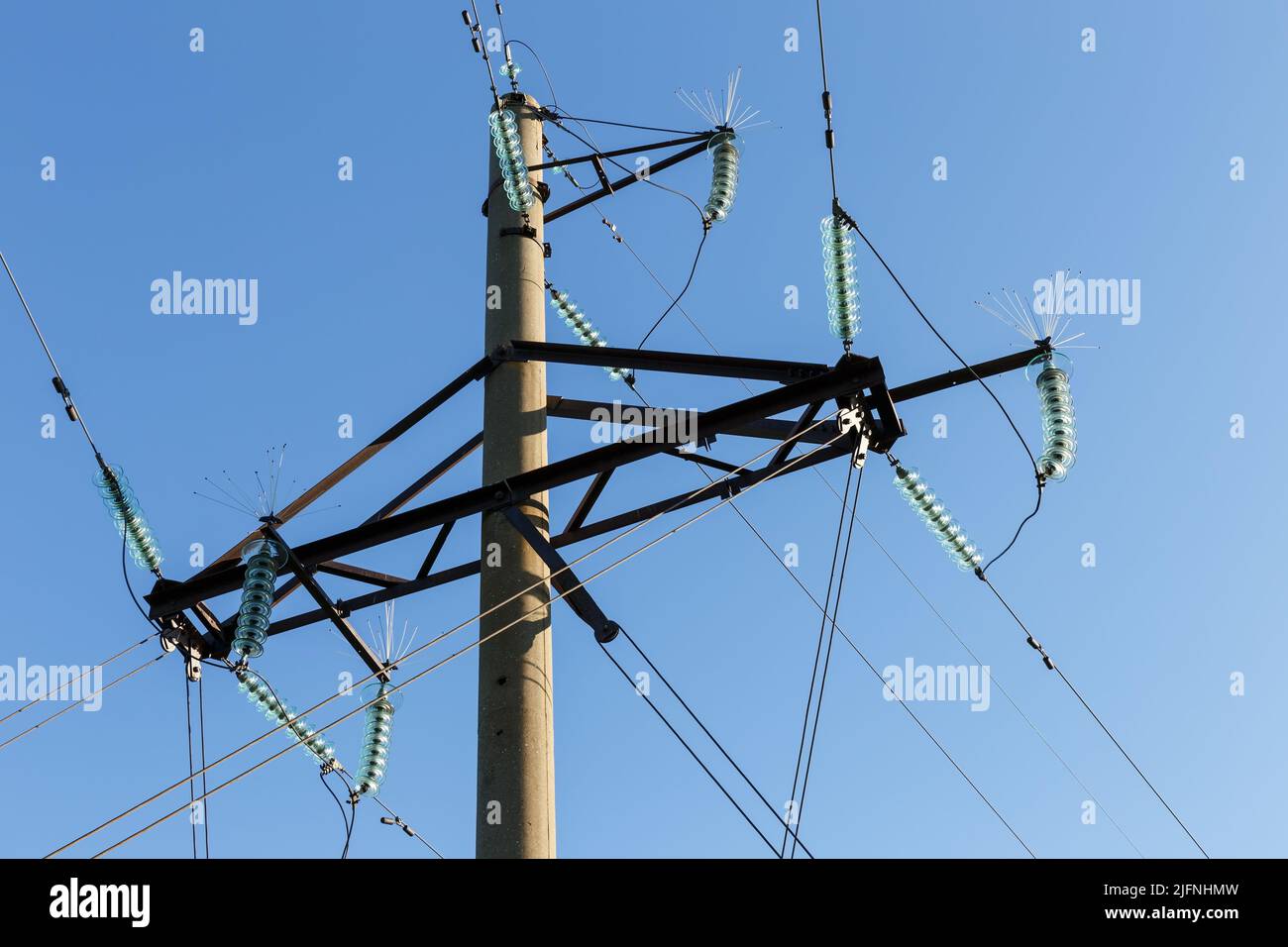 Pylons Inslulators Concrete electricity pylon with glass insulators and bird spikes ...