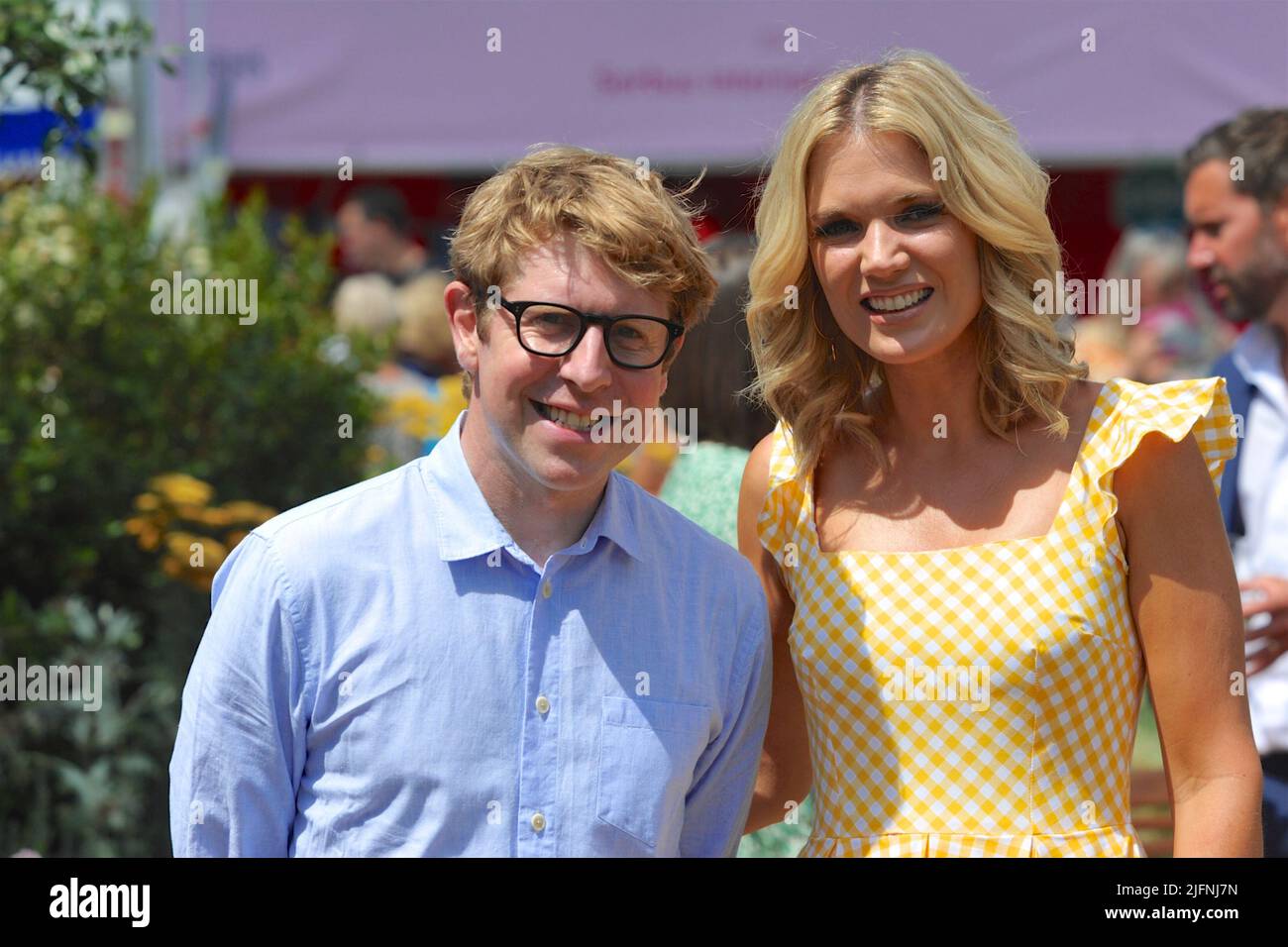 Hampton Court Palace, Surrey, UK - 04.06.2022, Josh Widdicombe (comedian and presenter) and Charlotte Hawkins (television/radio presenter, newsreader and journalist) at the opening day of the RHS Hampton Court Palace Garden Festival.  Held since 1993, the show is the most prestigious flower and garden event in the United Kingdom and the world’s largest annual flower show.  The show takes 18 months to plan and arrange and offers an eclectic mix of beautiful gardens, floral marquees and pavilions, spread over 34 acres, either side of the dramatic long water lake. Stock Photo