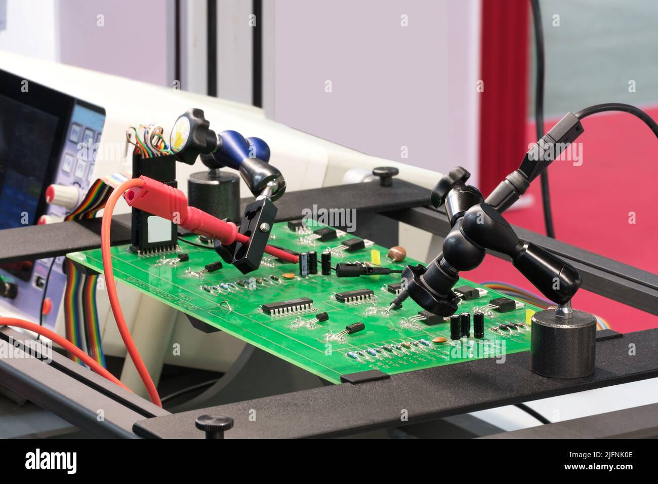 Chip testing equipment. A closeup study of a test sample of a transistor chip under a