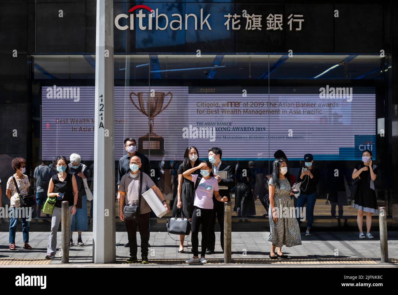 Hong Kong, China. 6th Oct, 2021. Pedestrians wait at a traffic light in front of the American multinational investment bank, Citibank or Citi, branch in Hong Kong. (Credit Image: © Budrul Chukrut/SOPA Images via ZUMA Press Wire) Stock Photo