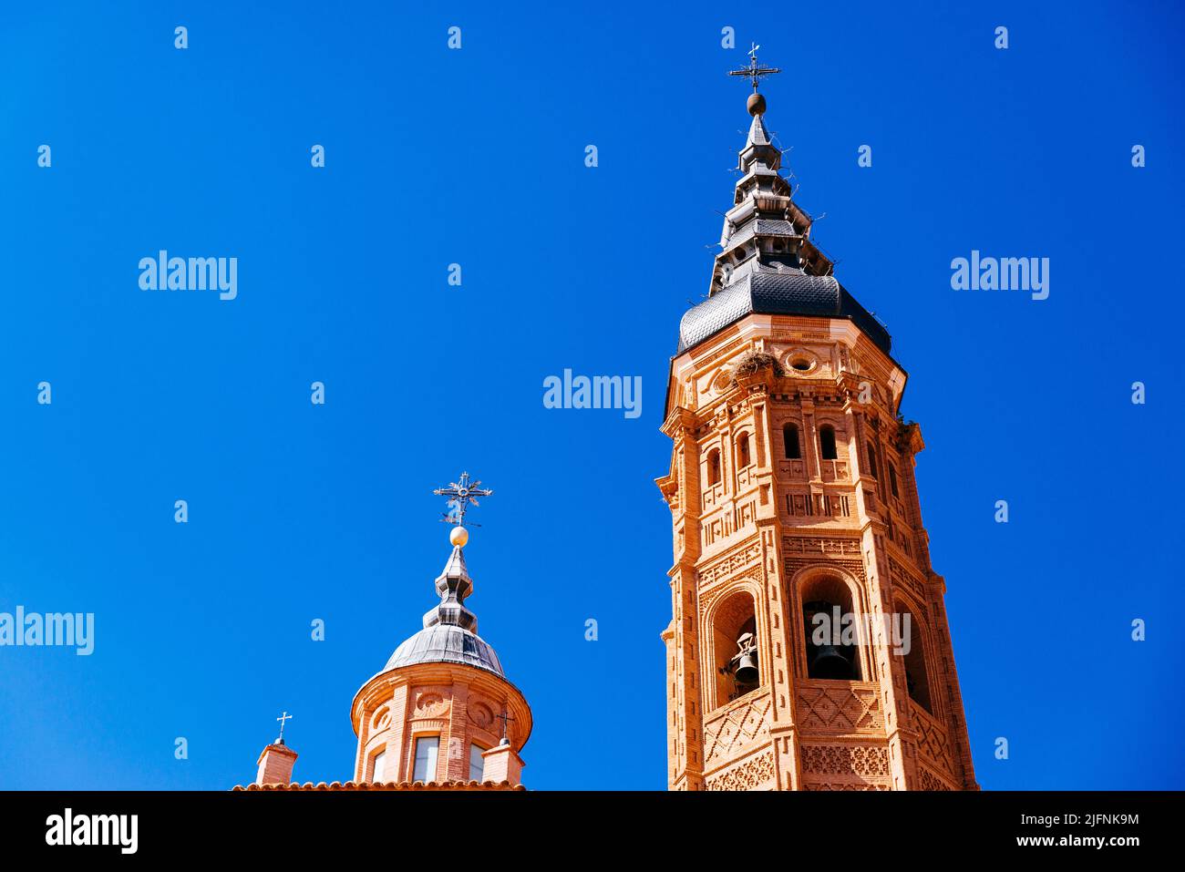 Collegiate church of Santa María. The 70 meter brick tower of octagonal base, and like most such towers, the decoration increases as one rises. Constr Stock Photo