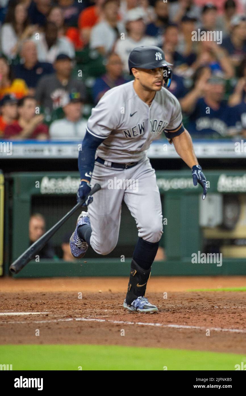 New York Yankees designated hitter Giancarlo Stanton (27) singles to