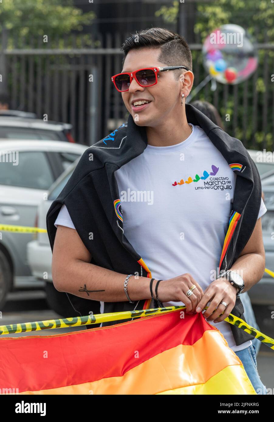 Photo of a young man at the start of  Lima's Marcha del Orgullo, the city's annual Pride march event. Stock Photo