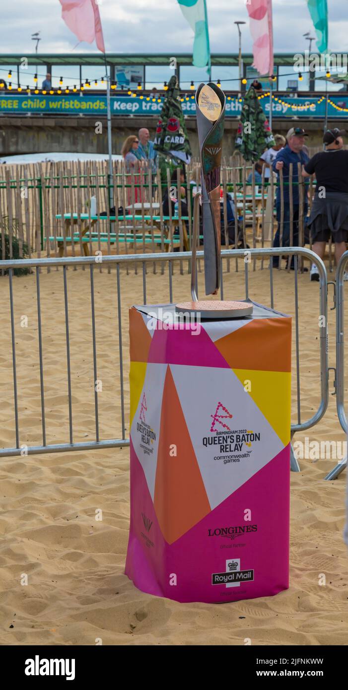 Bournemouth, Dorset UK. 4th July 2022. The Queen's Baton Relay arrives in Dorset, as the Baton makes it's way to the Commonwealth Games in Birmingham, visiting 72 nations and territories on a 294 day long journey across the Commonwealth. In Dorset it visits Portland and Poole before travelling along the seafront to Bournemouth Pier, taking a ride on the zip wire, followed by a community celebration. Credit: Carolyn Jenkins/Alamy Live News Stock Photo