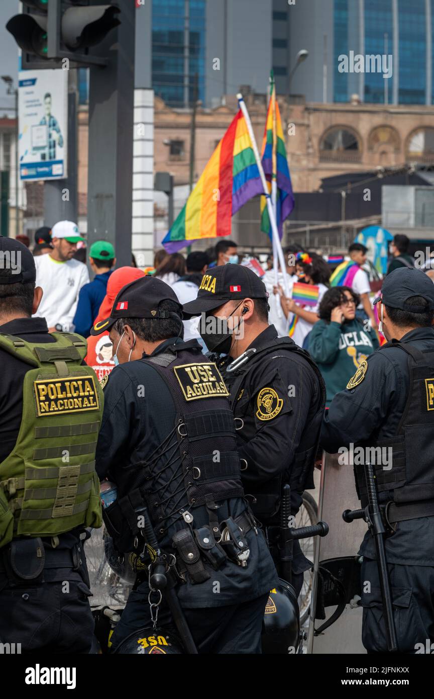 Photo of national police offers talking prior to start of Lima's Marcha del Orgullo, the city's annual Pride march event. Stock Photo