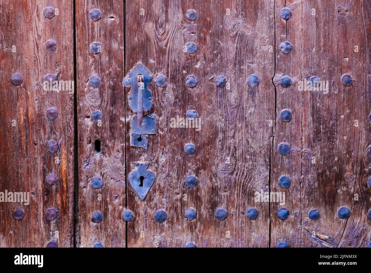 Old Studded Wooden Door with Metal Handle. Daroca, Zaragoza, Aragón, Spain, Europe Stock Photo