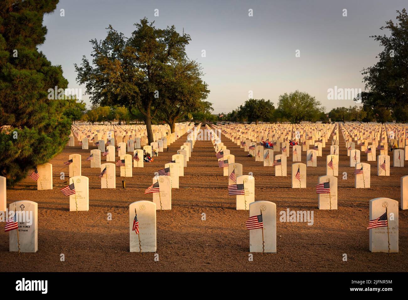 The evening sun sets on American graves at a west Texas national